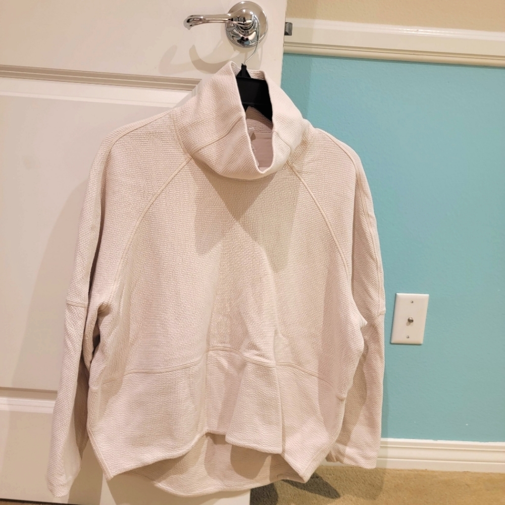 Cream Lululemon turtle neck running sweater